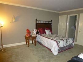 Double headboard, black leather sofa