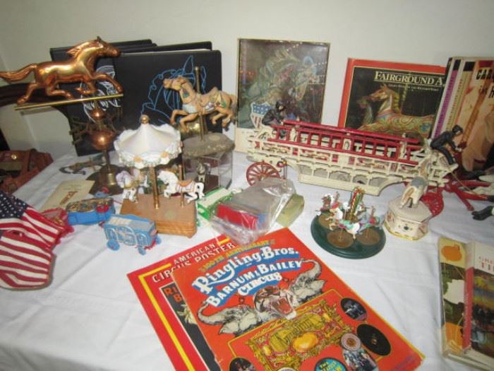 Collection of circus and carousel books and figurines