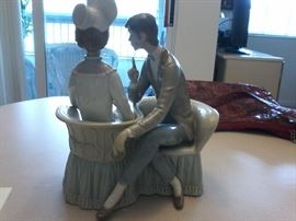  Lladro Man, Women and dog on a courting chair #4830.http://www.ctonlineauctions.com/detail.asp?id=666328