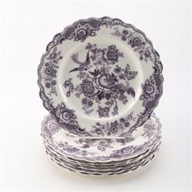 Vintage Crown Ducal "Bristol" Plates: A set of seven Crown Ducal ceramic plates in the Bristol pattern. Each piece is presented in the Mulberry colorway and feature a botanical transferware design with scalloped borders. They are marked to the underside, “Bristol, Crown Ducal, England”.