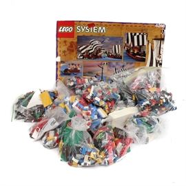 Large Assortment of Lego Pieces: A large assortment of Lego pieces. Included is a vast array of loose Lego building blocks and accessories. Also included are an assortment of instruction booklets.