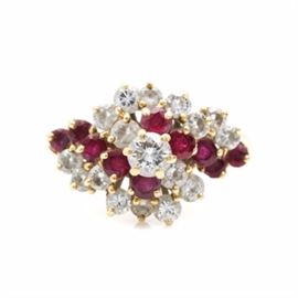18K Yellow Gold 1.79 CTW Diamond and Ruby Ring: An 18K yellow gold 1.79 ctw diamond and ruby ring. This ring features alternating aslant rows of diamonds and rubies on an open stepped setting.