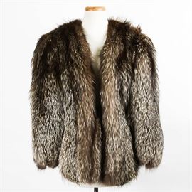 Vintage Fox Fur Shawl: A vintage collarless fox fur shawl labeled “Furs By Berkower Detroit”. The shawl is made of a very soft gray tipped brown fur. It has a shawl collar and long, open sleeves, with a scalloped hem. It is lined in black satin. The arms can be unsnapped to hang free.