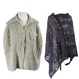 Women's Ponchos: A selection of two women’s ponchos. Included is a Love a Little oatmeal heater poncho with ribbed styling and including a spread collar, button front and flower accent. Also, a blue openwork poncho with bias cut styling.