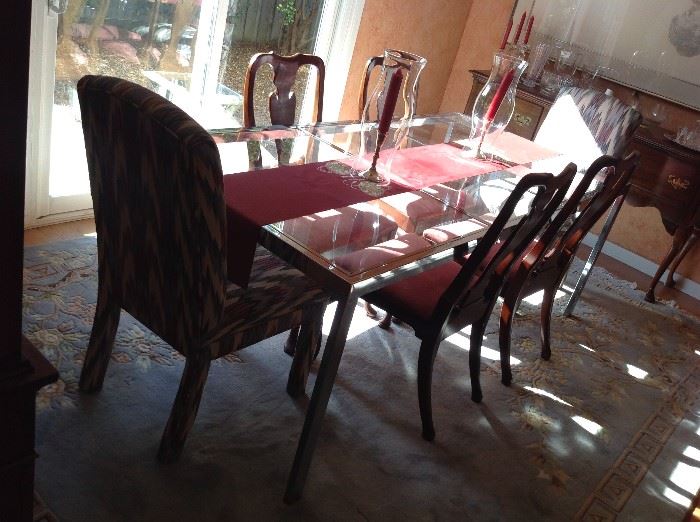 Glass / Chrome banquet table with 6 chairs $ 400.00
