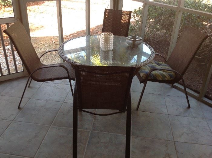 Outdoor Glass Top Table / 4 Chairs (Small amount of rust on chair arms) $ 100.00