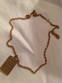 14 kt gold pendant / chain - pendant says Banque Suisse - 21 grams weight - $ 450.00