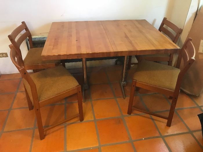 Solid butcher block table with chrome legs! Danish modern chairs (6 total - only 4 shown)
