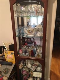 One of a few curio cabinets packed with things like: Tiffany Blue Crystal, Ruby Glass, German painted porcelains & MORE.