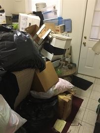 Ommmm- yep- that's not garbage!!! It's a kitchen void of a stove, fridge or table but FULL- FULL of...yet to be discovered!!! We know there are boxes of purses, bags of clothing & a recliner!!! We are excited to discover what else might be waiting to be shared with you!