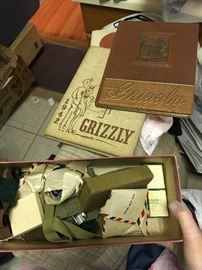 This box is a treasure of military buttons, patches, songbook -etc...