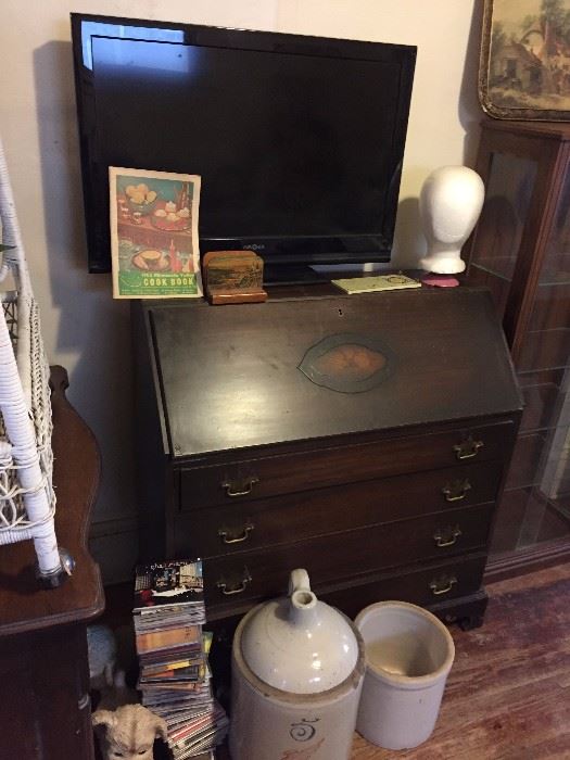 desk with pigeon holes, crocks, jug, tv