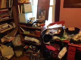 old sewing machine, old wooden office chair buried under other items!, buttons in tins, small,new frames, sewing notions