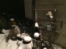 outside there are MANY garden shelves, decor items, some rusty and some new