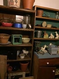 more McCoy and other pottery pieces in basement