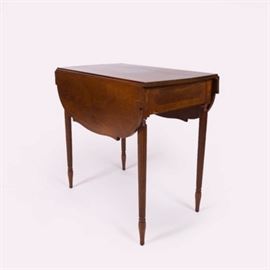 Hepplewhite Style Walnut Occasional Table with Marquetry: A Hepplewhite style, walnut occasional table with marquetry. The rectangular top has two rounded and shaped drop leaves above an apron with inlaid borders flanked by urn shaped marquetry between four tapered, fluted legs terminating on turned vase shaped feet.