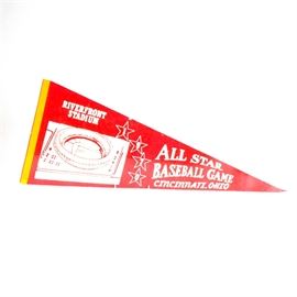 1970 All-Star Baseball Pennant: A 1970 All-Star baseball full-size pennant. The pennant is a semi-soft felt that has a red body, yellow border and white graphics and lettering. There is an artist rendition of Riverfront Stadium from an areal view; four stars with a digit inside that reads “1970” and the lettering is “All Star Baseball Game Cincinnati, Ohio”. Riverfront Stadium opened in June of 1970. It was the home to the Cincinnati Reds from 1970-2002. This is the All-Star game in which Pete Rose barreled over Ray Fosse for the winning run.