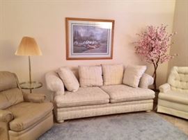 Tan Barcalounger, sofa and pink apple blossom tree