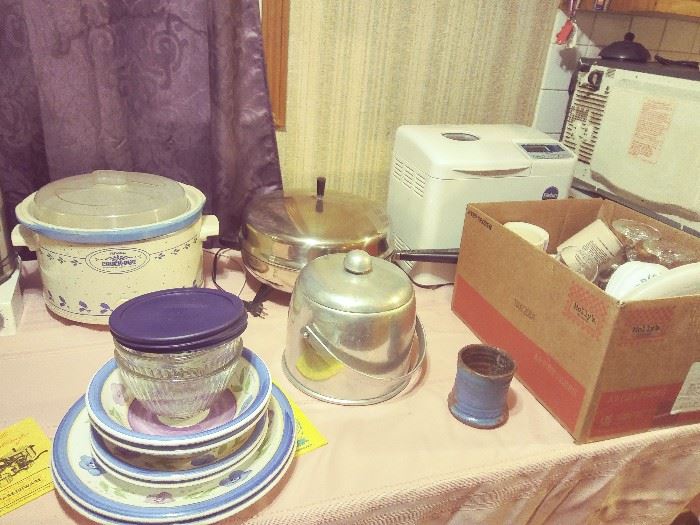 BREAD MAKER, MICRO-WAVE, CUPS, GLASSES, AND ASSORTMENT OF DISHWARE.