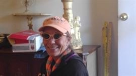 Sandy wearing the peach colored cat glasses