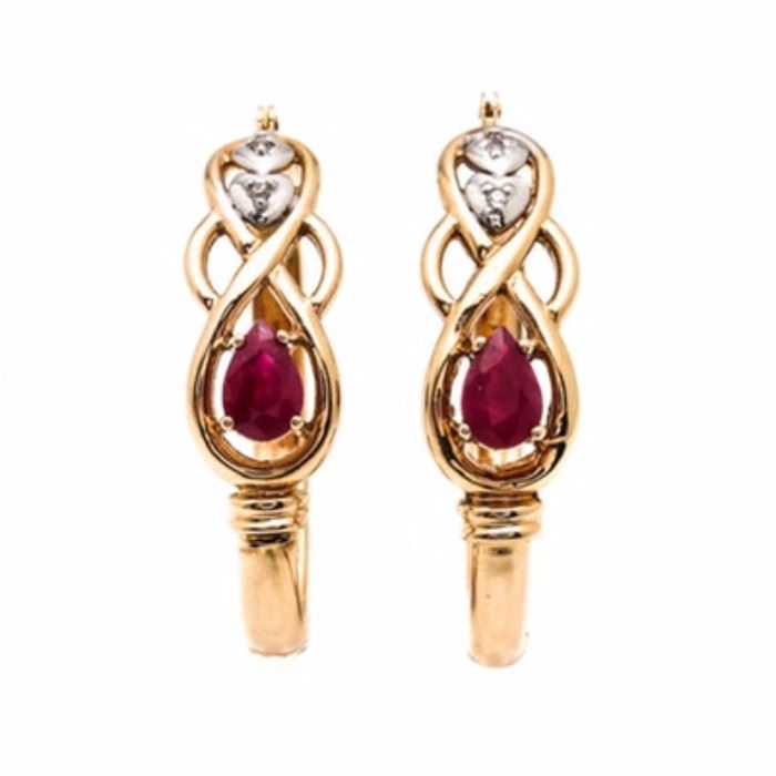 14K Yellow Gold Ruby and Diamond Hoop Earrings: A pair of 14K yellow gold ruby and diamond hoop earrings. These earrings feature prong set, faceted pear rubies in a knot design that leads to a white gold accent containing a single diamond in each earring.