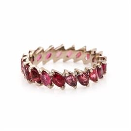 14K White Gold 4.00 CTW Ruby Eternity Band: A 14K white gold 4.00 ctw ruby eternity band. This ring showcases twenty marquise faceted rubies adorned throughout the entire band.