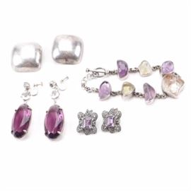 Collection of Sterling Silver Jewelry Including Amethyst and Judith Jack: A collection of sterling silver jewelry including amethyst and Judith Jack. This collection of four pieces includes a bracelet and three pairs of earrings. Featured are a pair of Judith Jack earrings with a faceted amethyst stone center and marcasite accents. Also included is a bracelet with amethyst and citrine stones. Each piece is either hallmarked or tested as sterling. The total weight, inclusive of all materials, is 2.605 ozt.