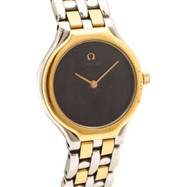 Omega Swiss Made Stainless Steel Wristwatch: An Omega Swiss made stainless steel wristwatch. This wristwatch features a two tone case and bracelet. The gold tone hands rests above the black dial that is blank except for the Omega logo that is located at the twelve o’clock hour position.