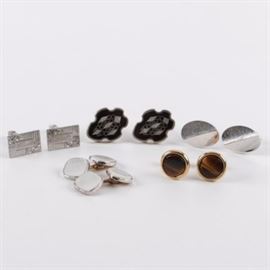 Vintage Mexican Sterling Silver Abalone Inlay and Other Cufflinks: An assortment consisting of two pairs of sterling silver and three pairs of base metal cufflinks. Among these are a vintage pair of Mexican sterling cufflinks featuring abalone shell inlay, marked “PGG Sterling Mexico.” Other material enhancements include tiger’s eye and mother of pearl. The total sterling silver weight, inclusive of all materials, is 0.820 ozt.