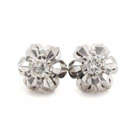 18K White Gold Diamond Stud Earrings: A pair of 18K white gold 0.48 ctw diamond stud earrings. This pair of stud earrings features a round brilliant cut diamond set above a stylized floral motif.