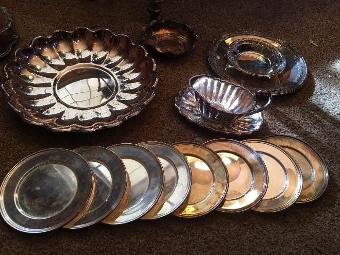 Mexican silver, silverplate chargers, graveyboat and many more serving pieces