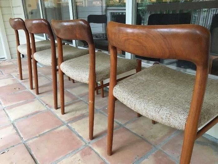 Set of 4 vintage Teak chairs with original upoholstery. Markd and made in Denmark. 1 leg as a repairable split and the upholstery is in good condition but with wear spots.