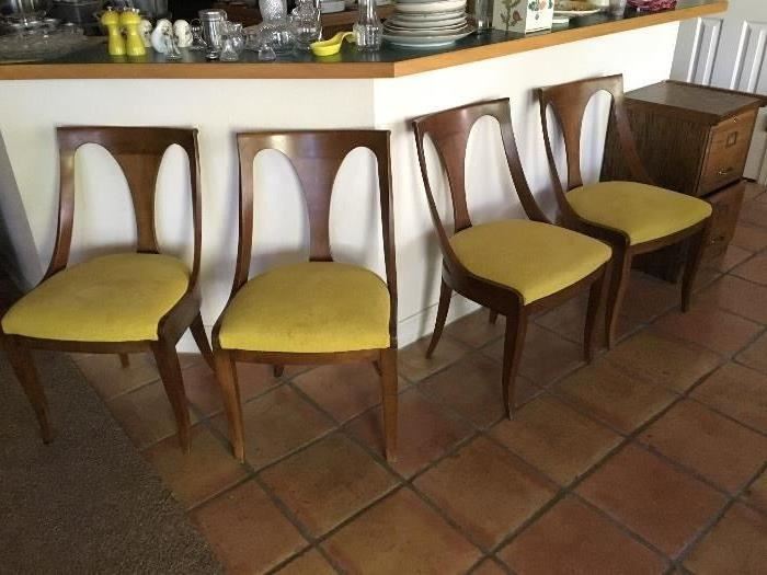 Set of four Kindel side chairs in the Hollywood Regency style with original yellow upholstery . W. 19 D. 18. H 33. 