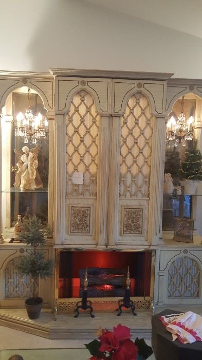 Large wall unit with chandeliers, faux fireplace, turntable, bar or TV area...she's a beauty!