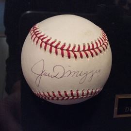 Joe DiMaggio signed baseball with Certificate of Authenticity.