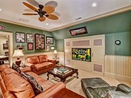 The green leather chair/ottoman have been sold.