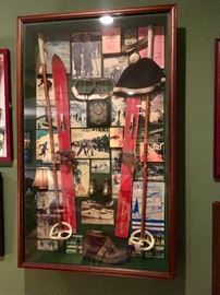 Framed shadowbox collage of vintage ski themed collectibles 