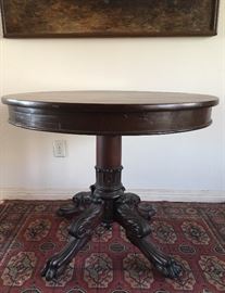 Antique 19th century tilt top center table with claw feet.  American Empire style circa 1830.