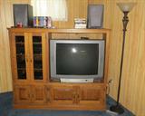 Entertainment center, tv and floor lamp