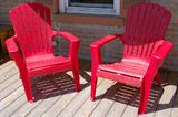 Red plastic adirondack chairs