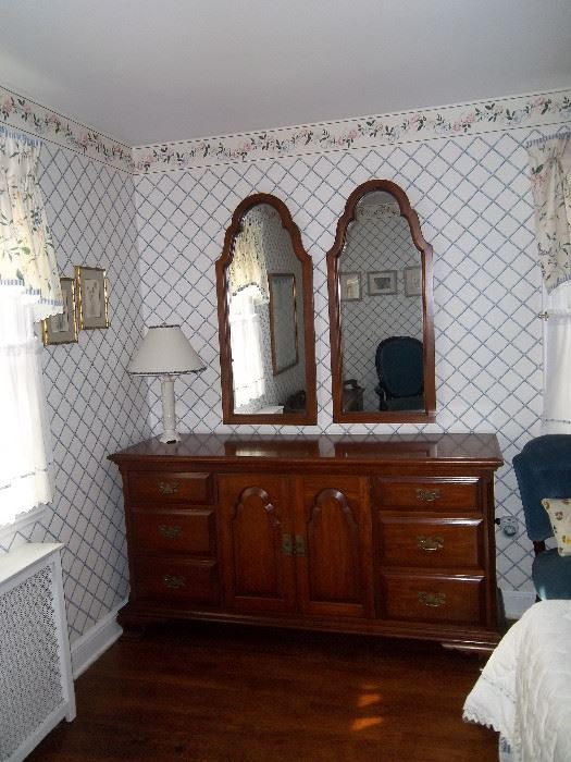 Solid Cherry wood dresser. Pennsylvania House.  Excellent condition. Two matching mirrors match the doors on dresser. 