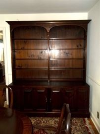 Large bookcase/hutch by Pennsylvania House. Solid pine. folding doors on bottom of bookcase. Top piece lifts off bottom for easy transporting. 7.5' tall x 6'