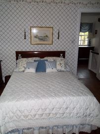 Framed watercolor of sea over bed