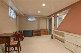 Four solid wood painted bookcases. One has doors. Also one grain chest pictured back right corner.