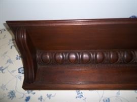 Close-up of bead and dart pattern shelf