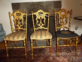 Victorian chair. One gold chair left. Pansy needlepoint on right.