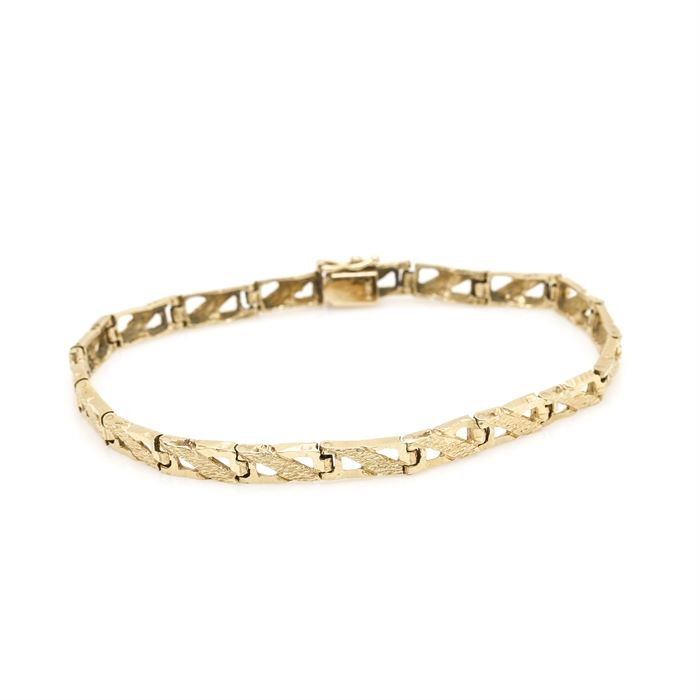 14K Yellow Gold Openwork Bracelet: A 14K yellow gold bracelet with textured openwork links.