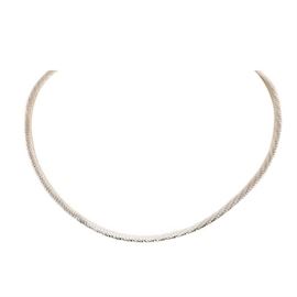 14K Two Tone Gold Omega Necklace: A 14K two tone gold omega necklace, displaying yellow gold on the obverse and white gold to the reverse.