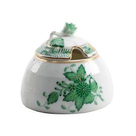 Herend Hungary Porcelain "Chinese Bouquet Green "Honey Pot: A Herend Hungary Chinese Bouquet Green honey pot. This ornate piece is rounded and shaped similar to the upper half of an egg. It has a flat base with a green painted floral motif and gold tone accenting. The lid is topped with a floral and leaf finial-like ornament It is marked on the underside of it’s base “Herend Hungary Handpainted” and “243IAV” with a maker’s mark.