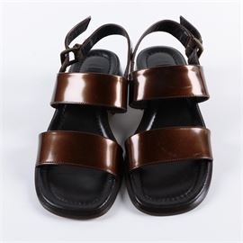 Country Road Marsala Patent Leather Sandals: A pair of Country Road Marsala patent leather sandals. These bronze tone shoes have toe and vamp straps and adjustable heel straps. They have block heels and come in a size 6.